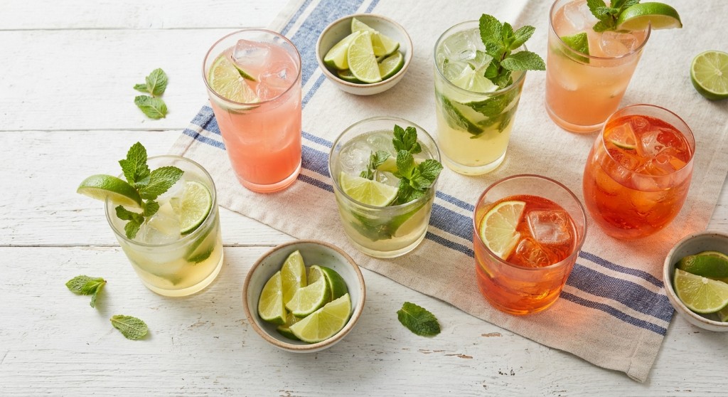 Mint and lime highballs arranged on a white table